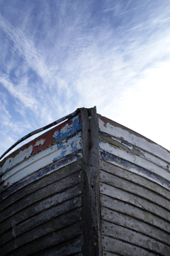 boat bow against a whispy cirrus sky