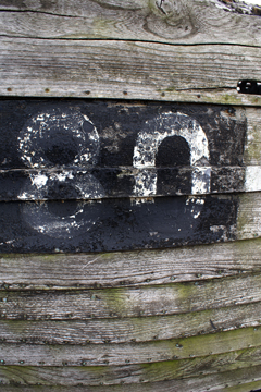 the figure 80 on the side of a fishing boat