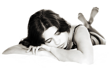 female asleep on bed