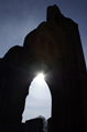 Sun shining through ruined Abbey arch