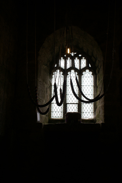 church bell ropes silhouetted against window