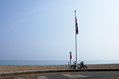 bike and flagpole on the seafront