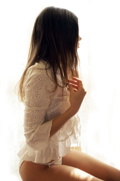 Female in white lace playing with her hair